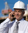 Photo of a business man on a construction site.